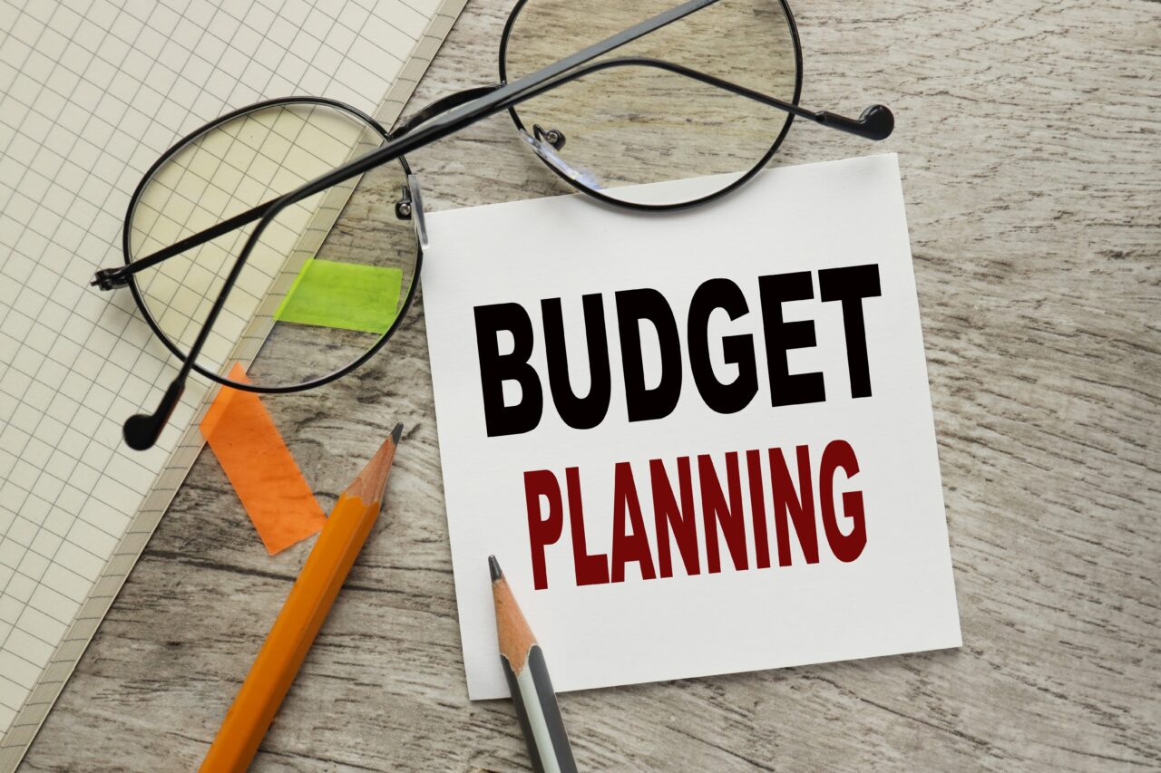 Budget,Planning.,Business,Concept.,Note,Paper,On,A,Wooden,Table. Budget,Planning.,Business,Concept.,Note,Paper,On,A,Wooden,Table.